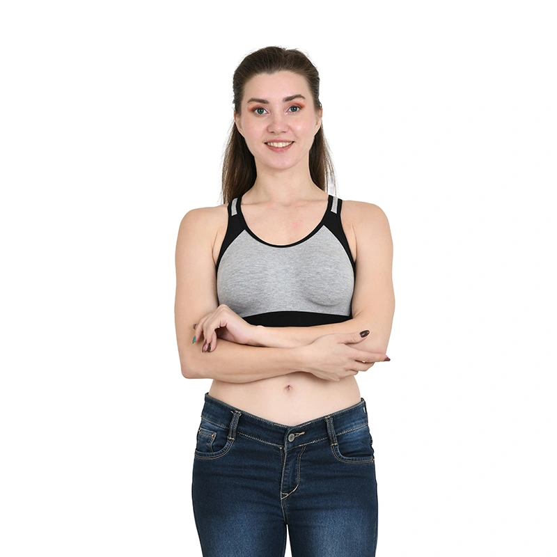 Grey and black colorblock racerback sports bra with blue denim jeans - lingerie ecommerce photography by Lohar Studio Delhi